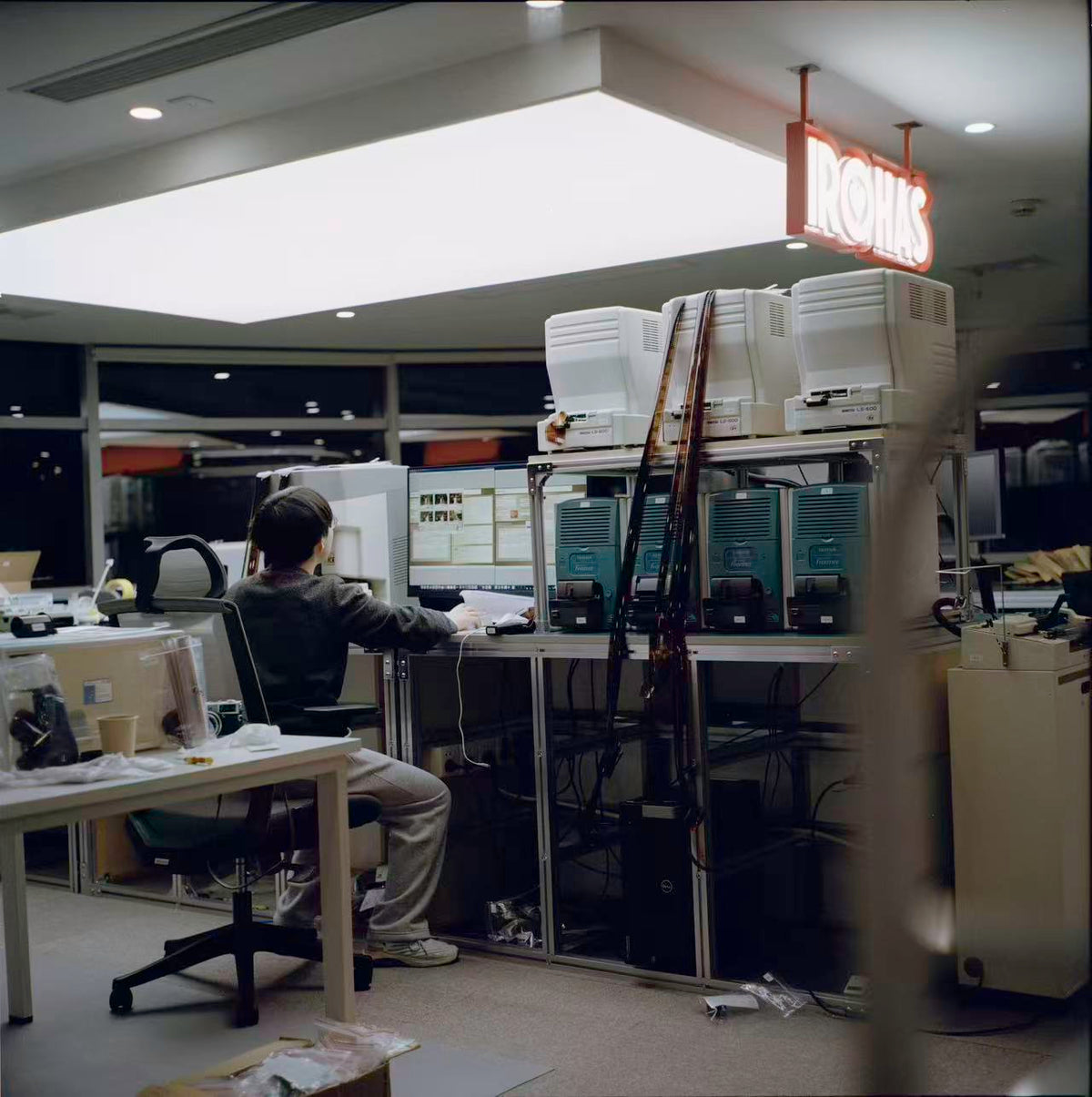 A team member working among film processing equipment at the Shanghai lab